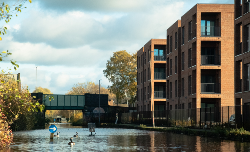 Brick apartments on a canal side setting 
